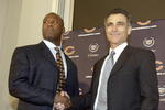 LIBERTYVILLE, IL - JANUARY 15:  Chicago Bears General Manager Jerry Angelo (R) congratulates former defensive coordinator for the St. Louis Rams, Lovie Smith (L), on his four year contract as head coach of the Chicago Bears at a media conference on January 15, 2004 in Libertyville, Illinois.  (Photo by Aynsley Floyd/Getty Images)
