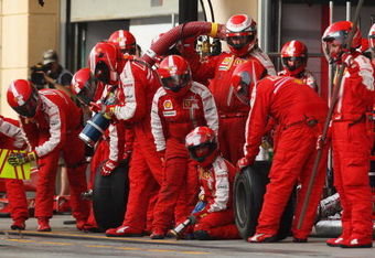 SAKHIR, BAHRAIN - APRIL 26:  Mechanics wait for Kimi Raikkonen of Finland and Ferrari to come in for a pitstop during the Bahrain Formula One Grand Prix at the Bahrain International Circuit on April 26, 2009 in Sakhir, Bahrain.  (Photo by Mark Thompson/Getty Images)