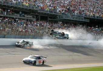 TALLADEGA, AL - APRIL 26:  Carl Edwards, driver of the #99 Claritin Ford, goes airborne as Ryan Newman, driver of the #39 Steweart-Haas Racing Chevrolet suffers damage and Dale Earnhardt Jr., driver of the #88 National Guard / AMP Energy Chevrolet drives at the conclusion of the NASCAR Sprint Cup Series Aaron's 499 at Talladega Superspeedway on April 26, 2009 in Talladega, Alabama.  (Photo by Jerry Markland/Getty Images for NASCAR)