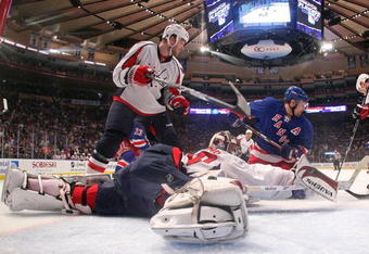 NEW YORK - APRIL 26: Simeon Varlamov #40 of the Washington Capitals defends the net against Chris Drury #23 of the New York Rangers during Game Six of the Eastern Conference Quarterfinal Round of the 2009 NHL Stanley Cup Playoffs at Madison Square Garden on April 26, 2009 in New York City. The Capitals defeated the Rangers 5-3.  (Photo by Bruce Bennett/Getty Images)