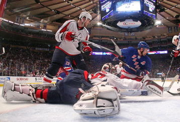 NEW YORK - APRIL 26: Simeon Varlamov #40 of the Washington Capitals defends the net against Chris Drury #23 of the New York Rangers during Game Six of the Eastern Conference Quarterfinal Round of the 2009 NHL Stanley Cup Playoffs at Madison Square Garden on April 26, 2009 in New York City. The Capitals defeated the Rangers 5-3.  (Photo by Bruce Bennett/Getty Images)