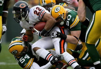 GREEN BAY, WI - NOVEMBER 16:  Running back Matt Forte #22 of the Chicago Bears is stopped by linebackers A.J. Hawk #50 and Brandon Chillar #53 of the Green Bay Packers during the NFL game at Lambeau Field on November 16, 2008 in Green Bay, Wisconsin.  (Photo by Doug Pensinger/Getty Images)
