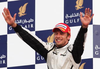 SAKHIR, BAHRAIN - APRIL 26:  Jenson Button of Great Britain and Brawn GP celebrates on the podium after winning the Bahrain Formula One Grand Prix at the Bahrain International Circuit on April 26, 2009 in Sakhir, Bahrain.  (Photo by Clive Mason/Getty Images)