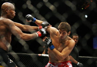 CHICAGO- OCTOBER 25:  Anderson Silva (L) punches Patrick Cote in the Middleweight Title Bout at UFC's Ultimate Fight Night at Allstate Arena on October 25, 2008 in Chicago, Illinois. (Photo by Tasos Katopodis/Getty Images)