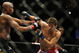CHICAGO- OCTOBER 25:  Anderson Silva (L) punches Patrick Cote in the Middleweight Title Bout at UFC's Ultimate Fight Night at Allstate Arena on October 25, 2008 in Chicago, Illinois. (Photo by Tasos Katopodis/Getty Images)