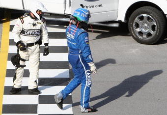 TALLADEGA, AL - APRIL 26:  Carl Edwards, driver of the #99 Claritin Ford, walks across the finish line after suffering damage during the final lap of the NASCAR Sprint Cup Series Aaron's 499 at Talladega Superspeedway on April 26, 2009 in Talladega, Alabama.  (Photo by Christian Petersen/Getty Images)