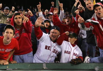 BOSTON - OCTOBER 16:  Fans of the Boston Red Sox celebrate after defeating the Tampa Bay Rays in game five of the American League Championship Series during the 2008 MLB playoffs at Fenway Park on October 16, 2008 in Boston, Massachusetts. The Red Sox defeated the Rays 8-7 to set the series at 3-2 Rays. (Photo by Jim McIsaac/Getty Images)