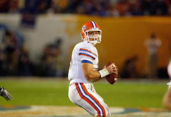 MIAMI - JANUARY 08:  Quarterback Tim Tebow #15 of the Florida Gators looks to pass the ball against the Oklahoma Sooners during the FedEx BCS National Championship Game at Dolphin Stadium on January 8, 2009 in Miami, Florida.  (Photo by Eliot J. Schechter/Getty Images
