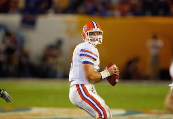 MIAMI - JANUARY 08:  Quarterback Tim Tebow #15 of the Florida Gators looks to pass the ball against the Oklahoma Sooners during the FedEx BCS National Championship Game at Dolphin Stadium on January 8, 2009 in Miami, Florida.  (Photo by Eliot J. Schechter/Getty Images