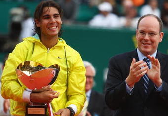MONTE CARLO, MONACO - APRIL 19:  Rafael Nadal (l) of Spain holds the winners trophy alongside Prince Albert II of Monaco (r) after his 6-3,2-6,6-1 victory in the final match against Novak Djokovic of Serbia during day seven of the ATP Masters Series at the Monte Carlo Country Club on April 19, 2009 in Monte Carlo,Monaco.  (Photo by Michael Steele/Getty Images)