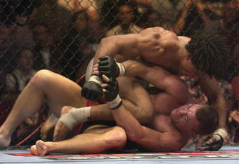 LONDON - JULY 13:  Carlos Newton of Canada battles with Matt Hughes of the USA during the Ultimate Fighting Championship, 'Brawl in the Royal Albert Hall', in the Royal Albert Hall London, England on July 13, 2002. (Photo by John Gichigi/Getty Images)