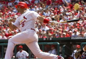 ST. LOUIS, MO - APRIL 23: Albert Pujols #5 of the St. Louis Cardinals hits an RBI single against the New York Mets on April 23, 2009 at Busch Stadium in St. Louis, Missouri. The Cardinals beat the Mets 12-8.  (Photo by Dilip Vishwanat/Getty Images)