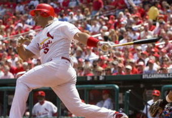 ST. LOUIS, MO - APRIL 23: Albert Pujols #5 of the St. Louis Cardinals hits an RBI single against the New York Mets on April 23, 2009 at Busch Stadium in St. Louis, Missouri. The Cardinals beat the Mets 12-8.  (Photo by Dilip Vishwanat/Getty Images)