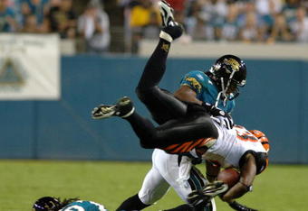 Cincinnati Bengals halfback Chris Perry  dives across midfield  against the Jacksonville Jaguars at Alltel Stadium October 9, 2005 in Jacksonville, Flordia. The Jaguars defeated the Bengals 23 - 20 in a Sunday Night game on ESPN.  (Photo by Al Messerschmidt/Getty Images)