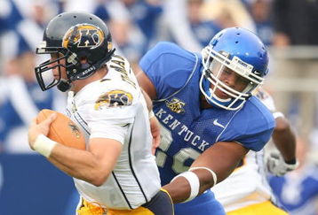 LEXINGTON, KY - SEPTEMBER 08:  Julian Edelman #1 of the Kent State Golden Flashes is presssured by Dominic Lewis #20 of the Kentucky Wildcats on September 8, 2007 at Commonwealth Stadium in Lexington, Kentucky.  (Photo by Andy Lyons/Getty Images)