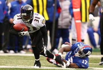 EAST RUTHERFORD, NJ - NOVEMBER 16:  Fabian Washington #31 of the Baltimore Ravens intercepts the ball as Plaxico Burress #17 of The New York Giants misses the tackle during their game on November 16, 2008 at Giants Stadium in East Rutherford, New Jersey.  (Photo by Al Bello/Getty Images)