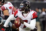 PHILADELPHIA - DECEMBER 31:  Michael Vick #7 of the Atlanta Falcons looks to pass against the Philadelphia Eagles in NFL action December 31, 2006 at Lincoln Financial Field in Philadelphia, Pennsylvania. The Eagles won 24-17.  (Photo by Jim McIsaac/Getty Images)