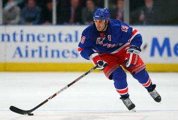 NEW YORK - DECEMBER 3:  Scott Gomez #19 of the New York Rangers skates with the puck during the game against the Pittsburgh Penguins on December 3, 2008 at Madison Square Garden in New York City. (Photo by Bruce Bennett/Getty Images)