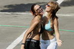 BUDAPEST, HUNGARY - JULY 30:  F1 glamour girls cool off in the hot weather during the qualifying session for the Hungarian F1 Grand Prix at the Hungaroring on July 30, 2005 in Budapest, Hungary.  (Photo by Clive Mason/Getty Images)