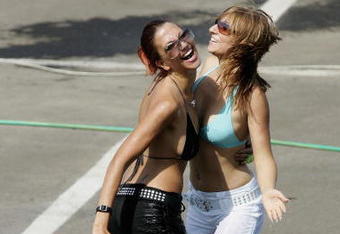 BUDAPEST, HUNGARY - JULY 30:  F1 glamour girls cool off in the hot weather during the qualifying session for the Hungarian F1 Grand Prix at the Hungaroring on July 30, 2005 in Budapest, Hungary.  (Photo by Clive Mason/Getty Images)