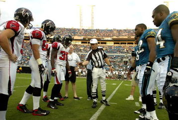 JACKSONVILLE, FL - AUGUST 9: Referee Walt Coleman tosses the coin as the Jacksonville Jaguars host the Atlanta Falcons at Jacksonville Municipal Stadium on August 9, 2008 in Jacksonville, Florida.   (Photo by Al Messerschmidt/Getty Images) 