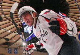 NEW YORK - APRIL 26: Alex Ovechkin #8 of the Washington Capitals celebrates a goal by Viktor Kozlov #25 (not shown) against the New York Rangers during Game Six of the Eastern Conference Quarterfinal Round of the 2009 NHL Stanley Cup Playoffs at Madison Square Garden on April 26, 2009 in New York, New York. The Capitals defeated the Rangers 5-3.  (Photo by Bruce Bennett/Getty Images)