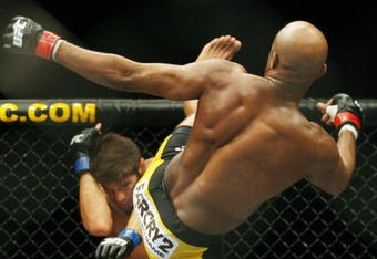 CHICAGO- OCTOBER 25:  Anderson Silva fights Patrick Cote in the Middleweight Title Bout at UFC's Ultimate Fight Night at Allstate Arena on October 25, 2008 in Chicago, Illinois. (Photo by Tasos Katopodis/Getty Images)
