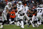 DENVER - NOVEMBER 23:  Quarterback JaMarcus Russell #2 of the Oakland Raiders hands the ball off to Justin Fargas #25 against the Denver Broncos during week 12 NFL action at Invesco Field at Mile High on November 23, 2008 in Denver, Colorado. The Raiders defeated the Broncos 31-10.  (Photo by Doug Pensinger/Getty Images)