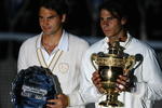 LONDON - JULY 06:  Rafael Nadal of Spain and Roger Federer of Switzerland pose for pictures with after Nadal won in five sets in the final on day thirteen of the Wimbledon Lawn Tennis Championships at the All England Lawn Tennis and Croquet Club on July 6, 2008 in London, England.  (Photo by Julian Finney/Getty Images)