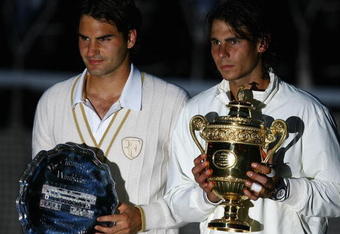LONDON - JULY 06:  Rafael Nadal of Spain and Roger Federer of Switzerland pose for pictures with after Nadal won in five sets in the final on day thirteen of the Wimbledon Lawn Tennis Championships at the All England Lawn Tennis and Croquet Club on July 6, 2008 in London, England.  (Photo by Julian Finney/Getty Images)