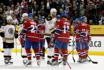 MONTREAL- APRIL 22:  Alexei Kovalev #27 and Georges Laraque #17 of the Montreal Canadiens shake hands with Stephane Yelle #18 and Zdeno Chara #33 of the Boston Bruins after Game Four of the Eastern Conference Quarterfinals of the 2009 Stanley Cup Playoffs at the Bell Centre on April 22, 2009 in Montreal, Quebec, Canada.  The Bruins defeated the Canadiens 4-1 winning the series 4-0.  (Photo by Richard Wolowicz/Getty Images)