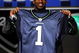 NEW YORK - APRIL 25: Seattle Seahawks draft pick Aaron Curry poses with his new jersey at Radio City Music Hall for the 2009 NFL Draft on April 25, 2009 in New York City (Photo by Jeff Zelevansky/Getty Images)