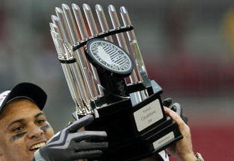 TAMPA, FL - DECEMBER 06:  Defensive end Orion Martin #90 and head coach Frank Beamer of the Virginia Tech Hokies holds up the ACC trophy after defeating the Boston College Eagles in the 2008 ACC Football Championship game at the Raymond James Stadium on December 6, 2008 in Tampa, Florida. Virginia Tech defeated Boston College 30-12.  (Photo by Doug Benc/Getty Images)