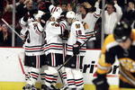 CHICAGO - DECEMBER 29:  Fans and members of the Chicago Blackhawks including James Wisniewski #43, Martin Lapointe #22 and Radim Vrbata #16 celebrate a goal with teammate Denis Arkhipov #19 in the 3rd period as Marc Savard #91 of the Boston Bruins skates away on December 29, 2006 at the United Center in Chicago, Illinois. The Bruins defeated the Blackhawks 5-3. (Photo by Jonathan Daniel/Getty Images)