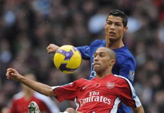 LONDON - NOVEMBER 08:  Gael Clichy of Arsenal clears the ball from Cristiano Ronaldo of Manchester United during the Barclays Premier League match between Arsenal and Manchester United at the Emirates Stadium on November 8, 2008 in London, England.  (Photo by Shaun Botterill/Getty Images)