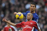 LONDON - NOVEMBER 08:  Gael Clichy of Arsenal clears the ball from Cristiano Ronaldo of Manchester United during the Barclays Premier League match between Arsenal and Manchester United at the Emirates Stadium on November 8, 2008 in London, England.  (Photo by Shaun Botterill/Getty Images)