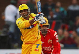 PORT ELIZABETH, SOUTH AFRICA - APRIL 20:  Mahendra Singh Dhoni of Chennai hits out during IPL T20 match between Chennai Super Kings and Royal Challengers Bangalore at St Georges Cricket Ground on April 20, 2009 in Port Elizabeth, South Africa.  (Photo by Tom Shaw/Getty Images)