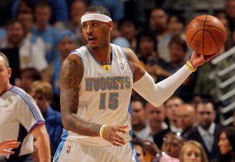 DENVER - APRIL 22:  Carmelo Anthony #15 of the Denver Nuggets controls the ball against the New Orleans Hornets in Game Two of the Western Conference Quarterfinals during the 2009 NBA Playoffs at Pepsi Center on April 22, 2009 in Denver, Colorado. The Nuggets defeated the Hornets 108-93. NOTE TO USER: User expressly acknowledges and agrees that, by downloading and or using this photograph, User is consenting to the terms and conditions of the Getty Images License Agreement.  (Photo by Doug Pensinger/Getty Images)