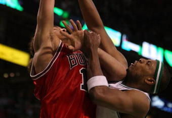 BOSTON - APRIL 28:  Paul Pierce #34 of the Boston Celtics is called for a foul as Joakim Noah #13 of the Chicago Bulls goes up for two in Game Five of the Eastern Conference Quarterfinals during the 2009 NBA Playoffs at TD Banknorth Garden on April 28, 2009 in Boston, Massachusetts. The Celtics defeated the Bulls 106-104 in overtime. NOTE TO USER: User expressly acknowledges and agrees that, by downloading and or using this photograph, User is consenting to the terms and conditions of the Getty Images License Agreement.  (Photo by Elsa/Getty Images)