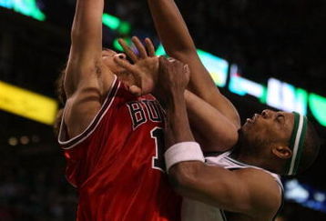 BOSTON - APRIL 28:  Paul Pierce #34 of the Boston Celtics is called for a foul as Joakim Noah #13 of the Chicago Bulls goes up for two in Game Five of the Eastern Conference Quarterfinals during the 2009 NBA Playoffs at TD Banknorth Garden on April 28, 2009 in Boston, Massachusetts. The Celtics defeated the Bulls 106-104 in overtime. NOTE TO USER: User expressly acknowledges and agrees that, by downloading and or using this photograph, User is consenting to the terms and conditions of the Getty Images License Agreement.  (Photo by Elsa/Getty Images)