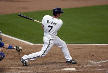 MILWAUKEE - APRIL 10: J.J. Hardy #7 of the Milwaukee Brewers swings at the pitch against the Chicago Cubs during the Opening Day game on April 10, 2009 at Miller Park in Milwaukee, Wisconsin. The Brewers defeated the Cubs 4-3. (Photo by Jonathan Daniel/Getty Images)