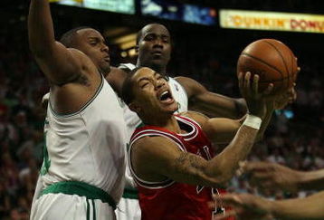 BOSTON - APRIL 28:  Derrick Rose #1 of the Chicago Bulls tries to take a shot around Glen Davis #11 and Kendrick Perkins #43 of the Boston Celtics in Game Five of the Eastern Conference Quarterfinals during the 2009 NBA Playoffs at TD Banknorth Garden on April 28, 2009 in Boston, Massachusetts. The Celtics defeated the Bulls 106-104 in overtime. NOTE TO USER: User expressly acknowledges and agrees that, by downloading and or using this photograph, User is consenting to the terms and conditions of the Getty Images License Agreement.  (Photo by Elsa/Getty Images)