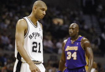 SAN ANTONIO - MAY 5:  Tim Duncan #21 of the San Antonio Spurs and Shaquille O'Neal #34 of the Los Angeles Lakers in game one of their Western Conference Semifinals during the 2003 NBA Playoffs on May 5, 2003 at the SBC Center in San Antonio, Texas.  The Spurs won 87-85.  NOTE TO USER:  User expressly acknowledges and agrees that, by downloading and/or using this Photograph, User is consenting to the terms and conditions of the Getty Images License Agreement. (Photo by Brian Bahr/Getty Images)