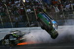 TALLADEGA, AL - APRIL 26:  Carl Edwards, driver of the #99 Claritin Ford goes airborne as Ryan Newman, driver of the #34 Stewart-Haas Racing Chevrolet hits the wall at the end of the NASCAR Sprint Cup Series Aaron's 499 at Talladega Superspeedway on April 26, 2009 in Talladega, Alabama.  (Photo by Todd Warshaw/Getty Images)
