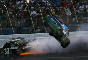 TALLADEGA, AL - APRIL 26:  Carl Edwards, driver of the #99 Claritin Ford goes airborne as Ryan Newman, driver of the #34 Stewart-Haas Racing Chevrolet hits the wall at the end of the NASCAR Sprint Cup Series Aaron's 499 at Talladega Superspeedway on April 26, 2009 in Talladega, Alabama.  (Photo by Todd Warshaw/Getty Images)