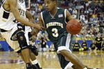 RALEIGH, NC - MARCH 20:  Luis Flores #3 of the Manhattan Jaspers drives to the basket during the second round game of the NCAA Division I Men's Basketball Tournament against Jamaal Levy #10 of the Wake Forest Demon Deacons at RBC Center on March 20, 2004 in Raleigh, North Carolina.  (Photo by Ezra Shaw/Getty Images)