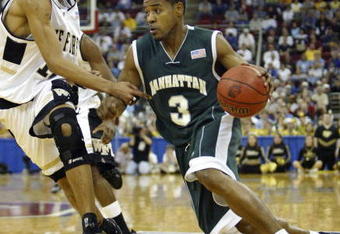 RALEIGH, NC - MARCH 20:  Luis Flores #3 of the Manhattan Jaspers drives to the basket during the second round game of the NCAA Division I Men's Basketball Tournament against Jamaal Levy #10 of the Wake Forest Demon Deacons at RBC Center on March 20, 2004 in Raleigh, North Carolina.  (Photo by Ezra Shaw/Getty Images)