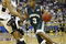 RALEIGH, NC - MARCH 20:  Luis Flores #3 of the Manhattan Jaspers drives to the basket during the second round game of the NCAA Division I Men's Basketball Tournament against Jamaal Levy #10 of the Wake Forest Demon Deacons at RBC Center on March 20, 2004 in Raleigh, North Carolina.  (Photo by Ezra Shaw/Getty Images)