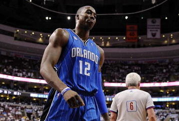 PHILADELPHIA - APRIL 24:  Dwight Howard #12 of the Orlando Magic walks to the bench for a timeout during Game Three against the Philadelphia 76ers of the Eastern Conference Quarterfinals during the 2009 NBA Playoffs at the Wachovia Center on April 24, 2009 in Philadelphia, Pennsylvania. The 76ers won 96-94.  NOTE TO USER: User expressly acknowledges and agrees that, by downloading and/or using this Photograph, user is consenting to the terms and conditions of the Getty Images License Agreement.  (Photo by Jeff Zelevansky/Getty Images)