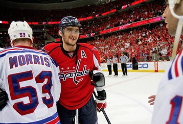 WASHINGTON - APRIL 28:  Alex Ovechkin #8 of the Washington Capitals smiles as he shakes the hand of Derek Morris #53 of the New York Rangers after defeating him during Game Seven of the Eastern Conference Quarterfinal Round of the 2009 Stanley Cup Playoffs on April 28, 2009 at the Verizon Center in Washington,  DC.  (Photo by Len Redkoles/Getty Images)